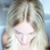 Blonde woman's hair, top view.