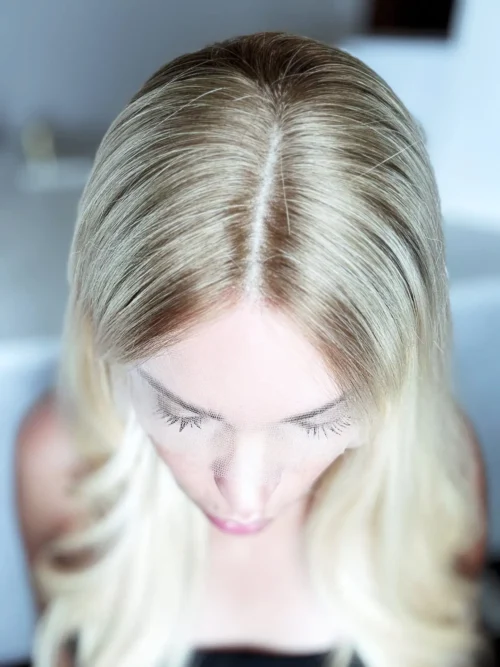 Blonde woman's hair, top view.