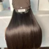 Brown human hair wig on mannequin.