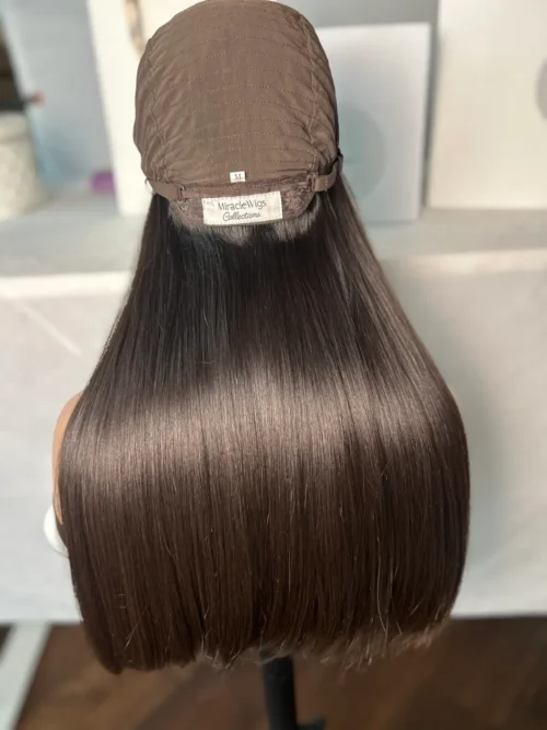 Brown human hair wig on mannequin.