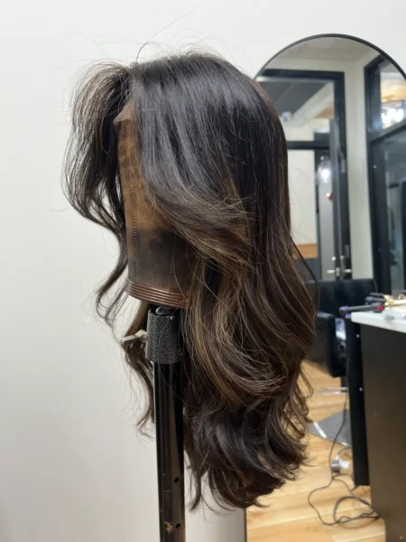 Brown wavy hair mannequin head.