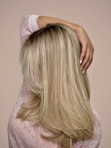 Woman with long, straight blonde hair.
