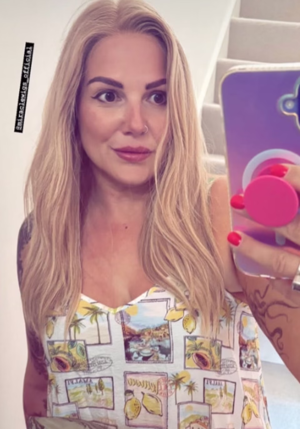 Curly brown wig on mannequin head display.