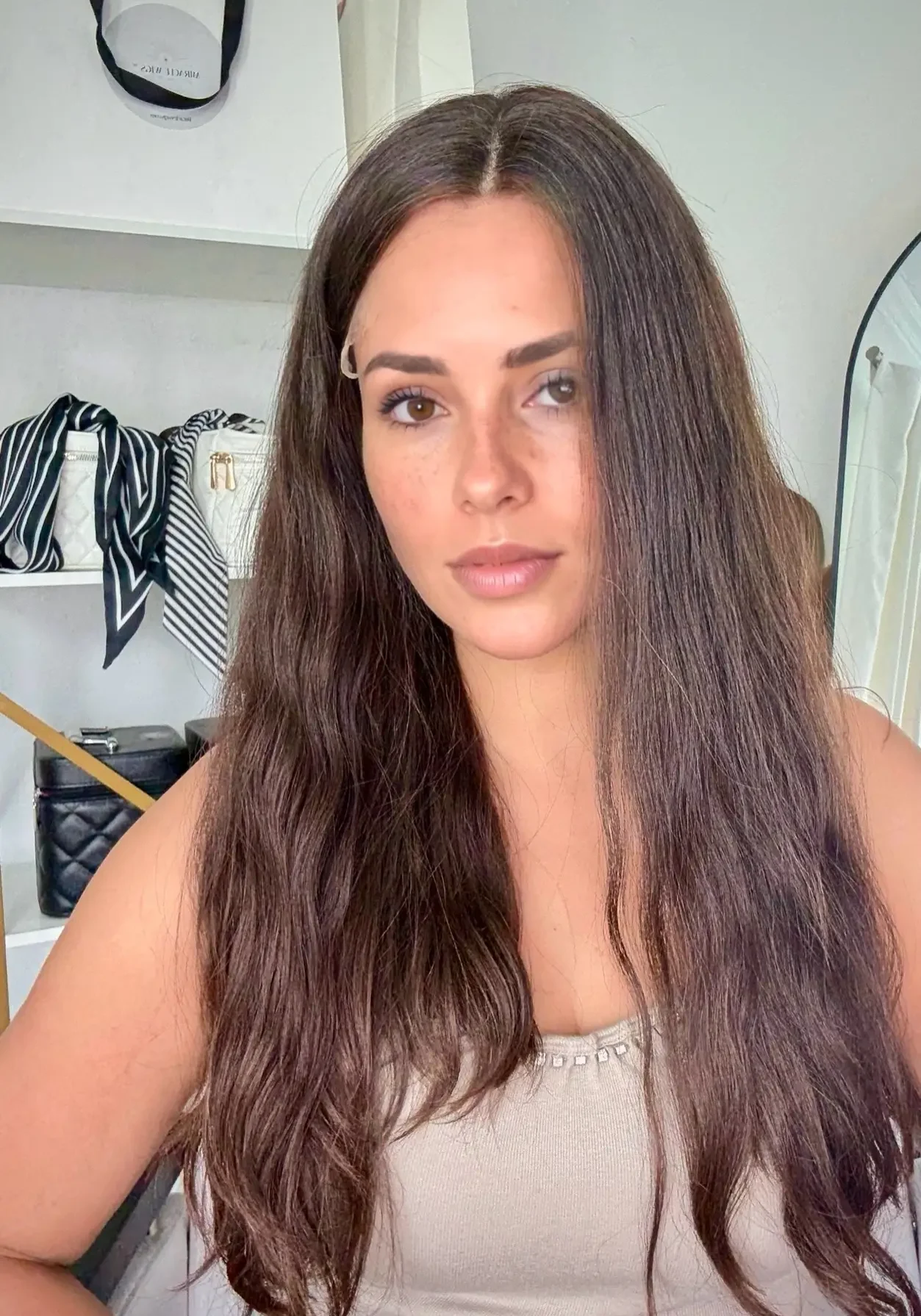 Woman with long hair in stylish room.