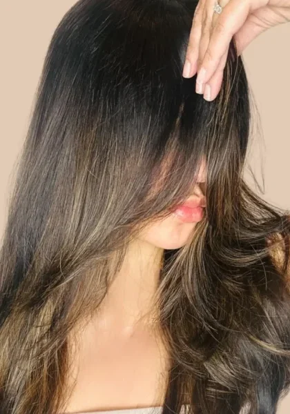 woman in butterfly haircut with balayage color